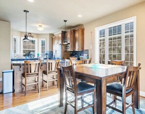 Kitchen and Dining — Open‑concept space with full amenities and seating for shared meals. - Ocean-View Coastal Retreat | Walk to Beach | Garage + EV Charging (Rockaway Beach)