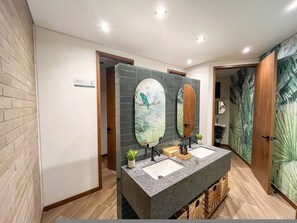 A modern bathroom with two sinks, a mirror, and a plant. - El Retiro Forest Retreat Peaceful Suite (Retiro)