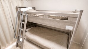 A bunk bed with a ladder, a pillow, and a tag on the headboard. - KOTONOHANA STAY | Near Ohori Park | Easy to Tenjin and Hakata | Kitchen Included (福岡市中央区荒戸)