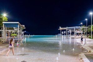 An outdoor water play area with multiple fountains and a clear view of the water. - Belle Escapes Aquarius' Panoramic Jewel 11th Floor (Cairns City)