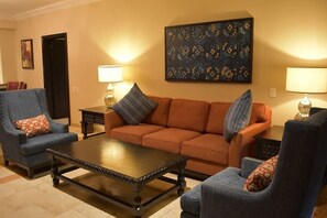 A living room with a sofa, armchairs, a coffee table, and two lamps. - 2BR/2B Presidential Suite at Pueblo Bonito Sunset with Exclusive Butler Service (Cabo San Lucas)