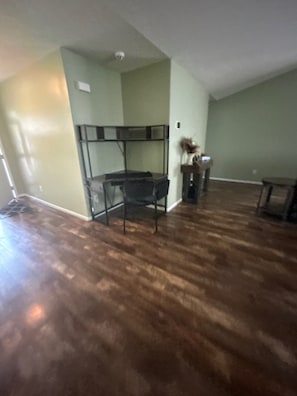 A room with a bunk bed, a desk, and a chair.