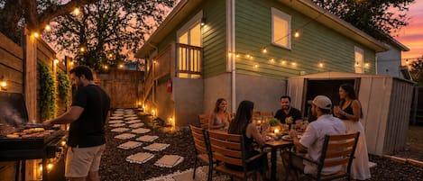 Beautiful backyard with outdoor dinning for 6, BBQ grill for outdoor grilling & game of cornhole to enjoy with friends & family