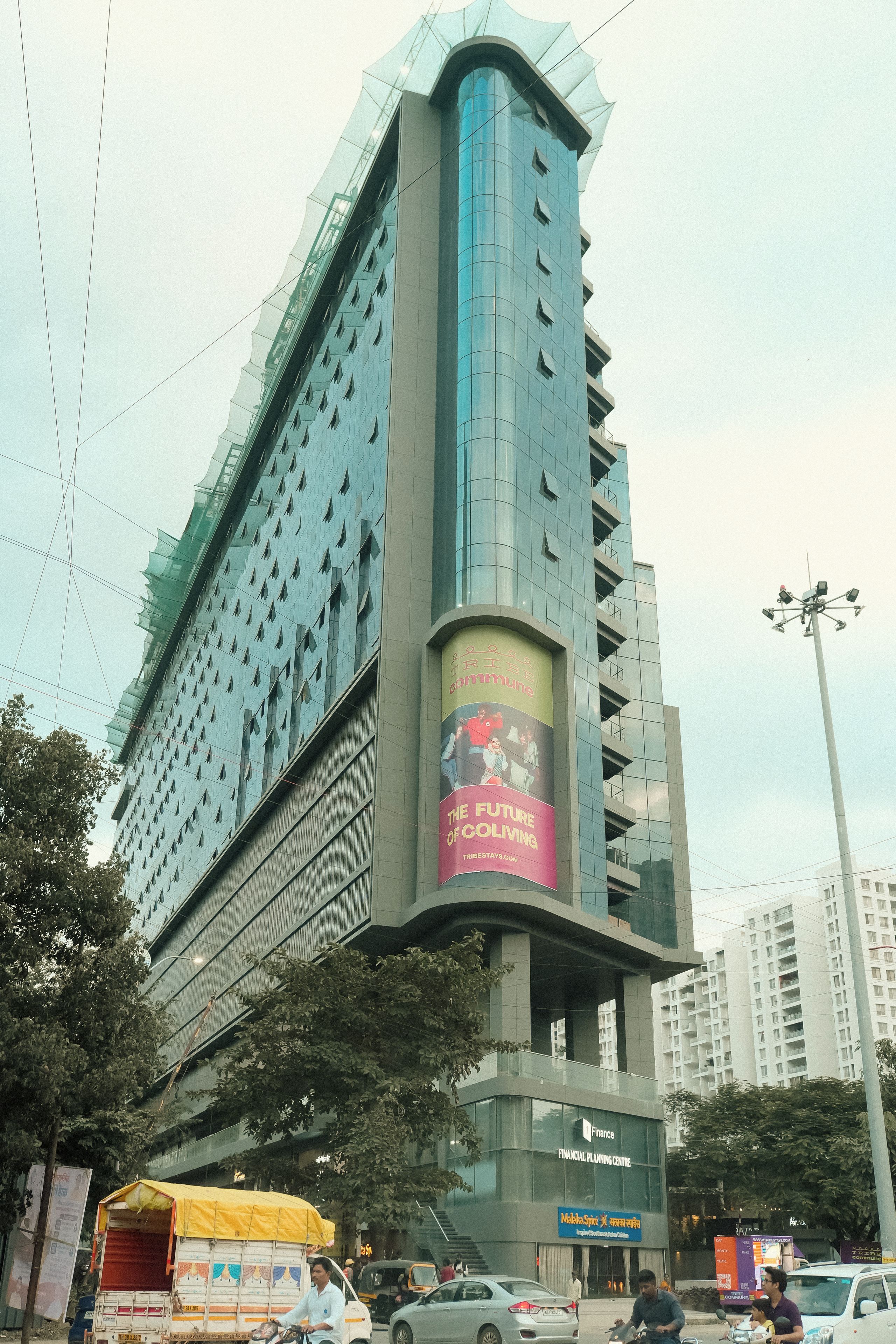 A multi-story building with a prominent advertisement on its facade.