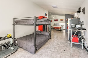 A bunk bed with a desk and a telescope in a room with tiled flooring. - 6 Mi to Spanish Springs! Private Unit w/ Projector (Lady Lake)