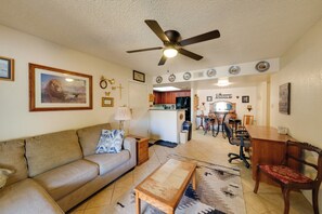 A living room with a sofa, coffee table, and a ceiling fan. - Work + Relax Poolside! Nurse-Ready Glendale Rental (Glendale)