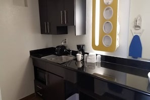 A compact kitchen with a sink, a coffee maker, and a microwave. - 2 Queen Beds | Suite, Non-Smoking, Kitchen (Fairfield)