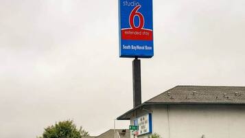 A sign for a Studio 6 extended stay hotel at South Bay/Naval Base.