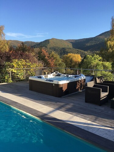 Villa with a hot tub, fireplace, and views of the Vosges