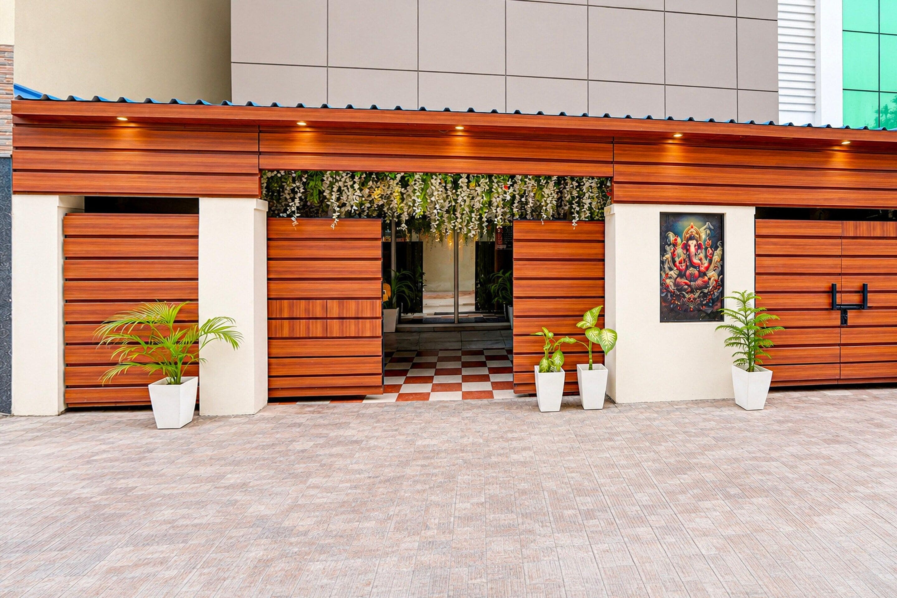 A building facade with a wooden panel design, a checkered floor pattern, and potted plants.