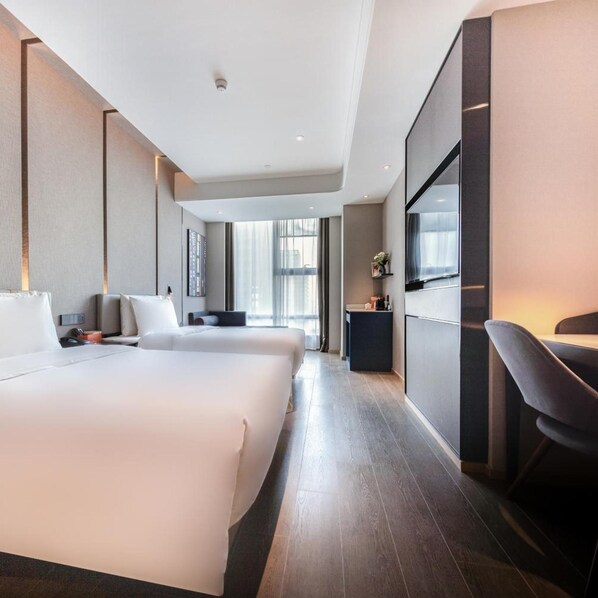 A modern hotel room with two beds, a desk, and a large window. - Atour Hotel Jinyin Lake Wuhan (Wuhan)