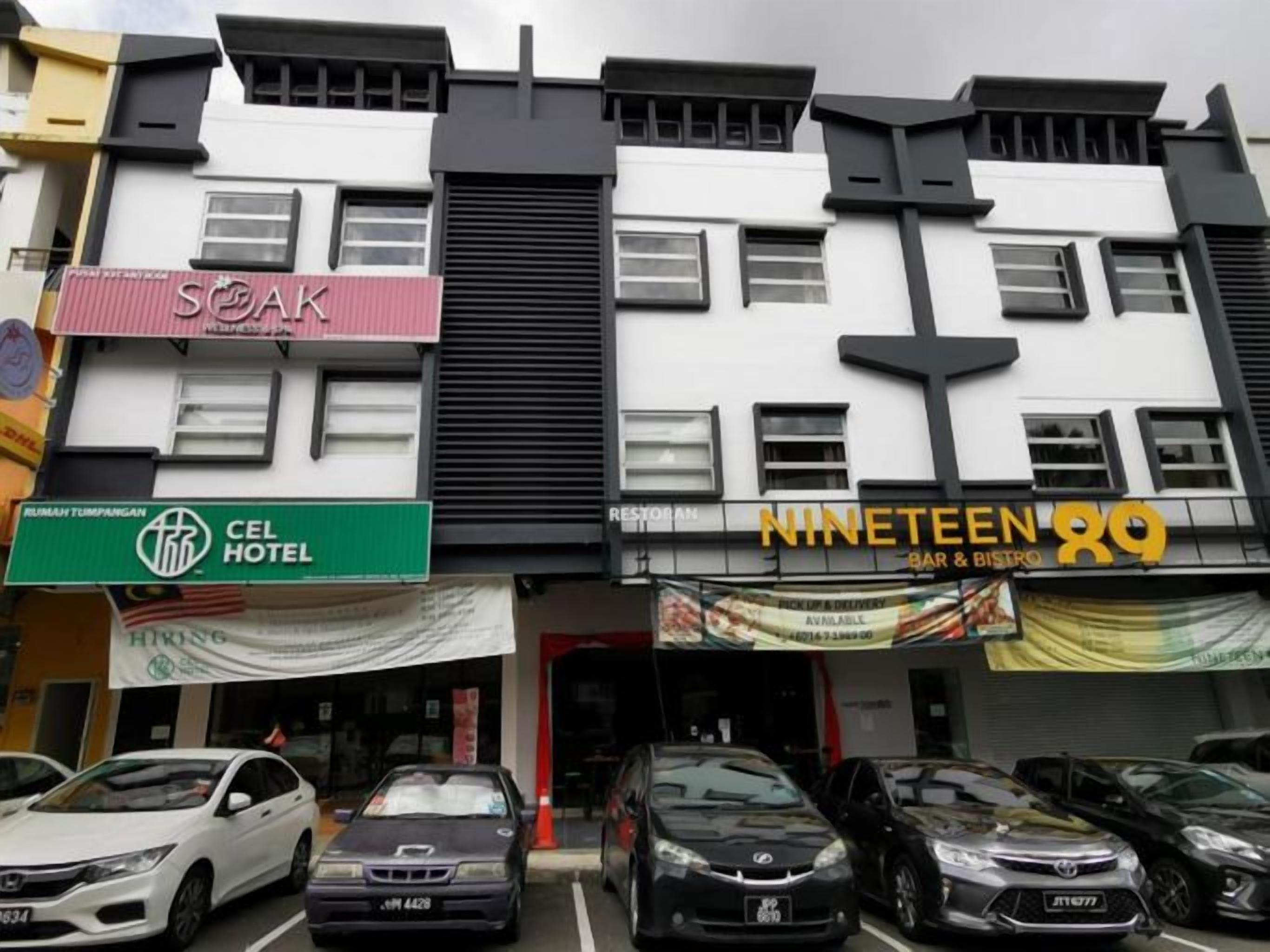 A multi-story building with various businesses including a hotel, a bar, and a restaurant.