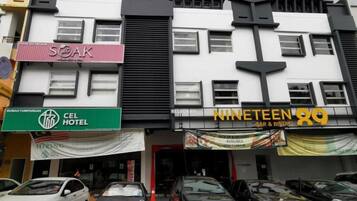 A multi-story building with various businesses including a hotel, a bar, and a restaurant.
