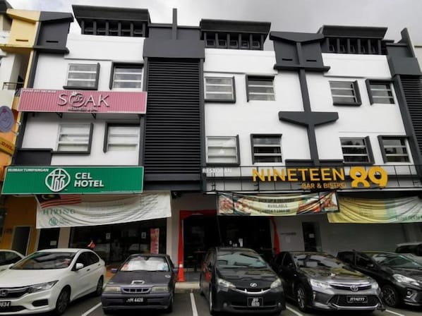 A multi-story building with various businesses including a hotel, a bar, and a restaurant. - Cel Hotel (Johor Bahru)