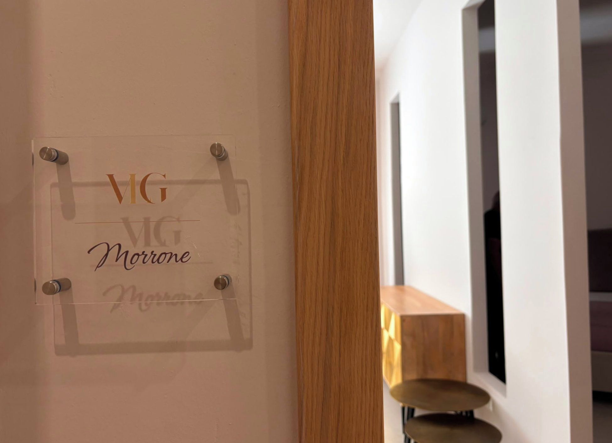 A sign with the text 'VG Morone' on a wall, indicating a room or area name.