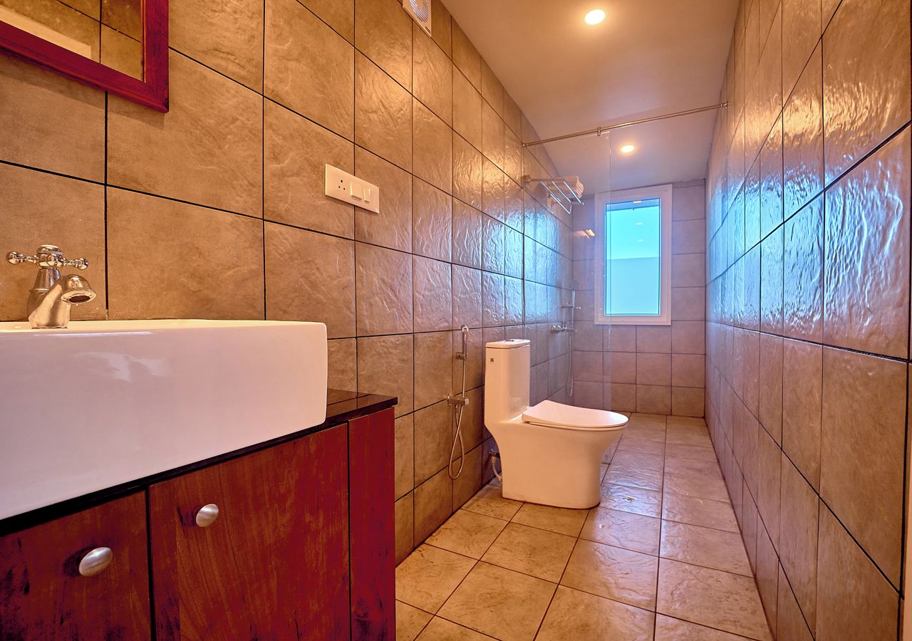 A bathroom with a bathtub, toilet, and shower.