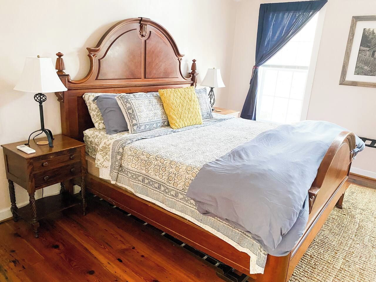 The primary bedroom has a king bed and futon chair that converts into a single bed. The room fills with glorious morning sun so we have provided blackout curtains you can close if you want to sleep in.