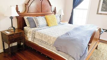 The primary bedroom has a king bed and futon chair that converts into a single bed. The room fills with glorious morning sun so we have provided blackout curtains you can close if you want to sleep in.
