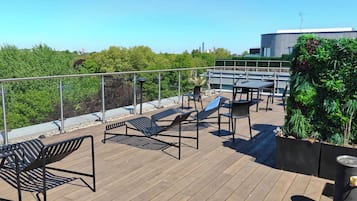 Rooftop Terrace: Breathtaking views and stylish seating for unforgettable sunset evenings!