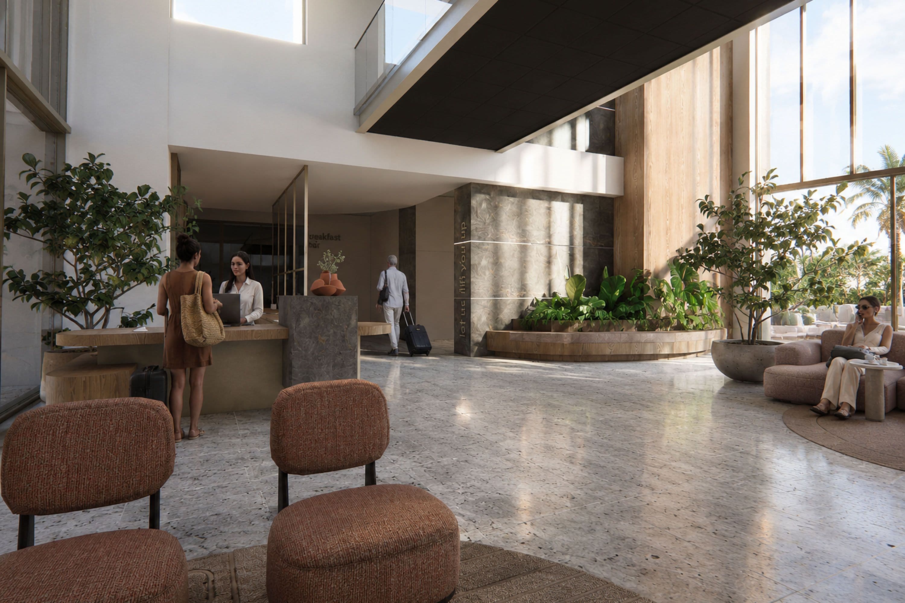 Un hall d’entrée spacieux, doté d’espaces aménagés avec des sièges, d’un comptoir de réception et de grandes fenêtres laissant entrer la lumière naturelle.
