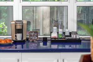 A coffee bar with a coffee machine, a sign reading 'Coffee & Tea BAR', and various coffee cups and containers. - 5 bedroom/ 3 Bathroom Tropical Resort w/Gym near Pompano Beach and Parks (Pompano Beach)