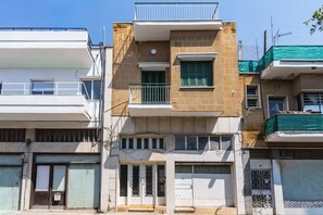 A multi-story residential building with balconies, a garage, and a gated entrance. - Casa Tomazo Spacious 2BRModern Heritage Old Town (Nicosia)