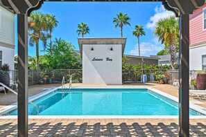 A swimming pool with a sign reading 'Leisure Bay' in the background. - ☀️White Sands Escape | Coastal Retreat | 700 Yards to Beach | Pool☀️ (Miramar Beach)