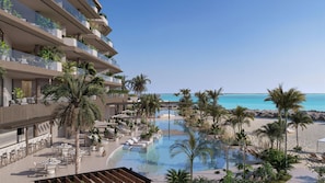A resort with a pool, palm trees, and a beach view.