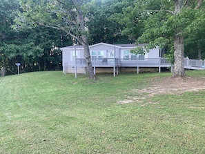 A two-story house with a covered porch and a fenced yard. - Country life,come and relax! (Crossville)