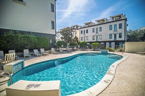 A swimming pool with lounge chairs and a 'KEEP OFF' sign. - Triple Sea - 4BR Blue Mountain Beach Retreat with Rooftop Terrace (Santa Rosa Beach)