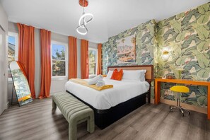 A hotel room with a bed, a bench, a desk, a chair, and a large window. - Modern Palm Springs Retreat| 4 BR 4 Bath| Central (Pittsburgh)