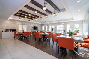 A spacious dining area with high ceilings, exposed beams, and pendant lighting. - 12 Min to Disney, Mickey & Minions Themed Rooms (Kissimmee)