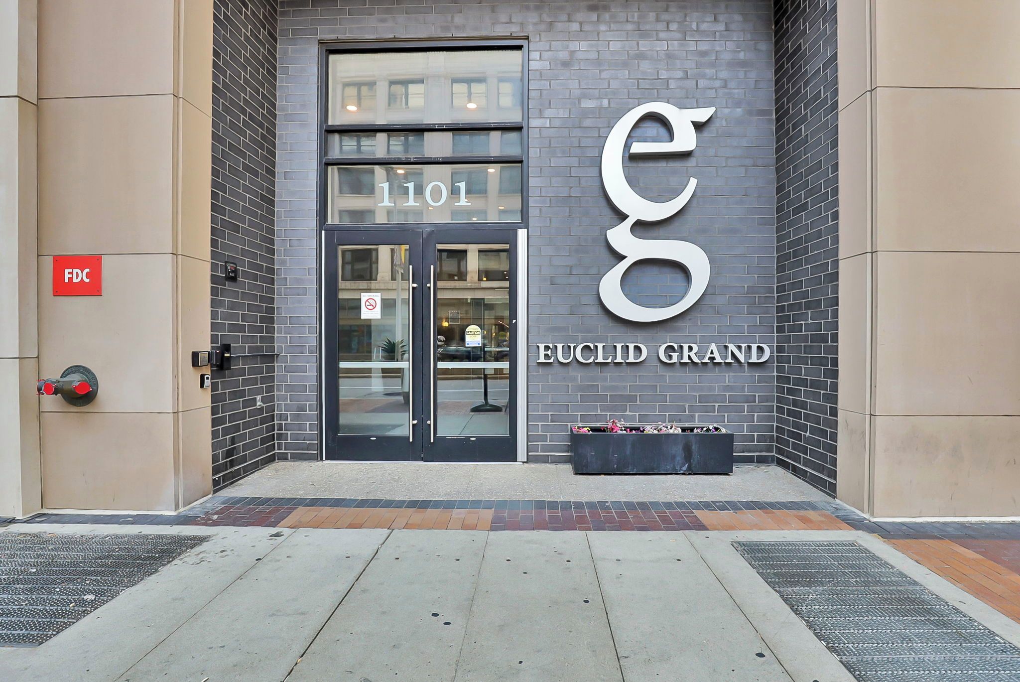 The entrance to a building with a large sign reading 'EUCLID GRAND' and the number '1101' above the door.