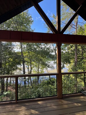 A covered outdoor area with a view of a lake and trees. - 9139 Orange -2-bedroom w/ Loft - Melton Hill Lake & Marina -Close to downtown UT (Oak Ridge)