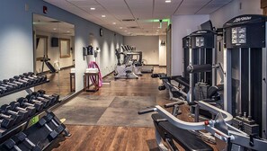 A gym with exercise equipment, a mirror, and a treadmill. - Ski-In/Ski-Out Spacious 1BR Condo at Grand Timber Lodge, Sleeps 4 (Breckenridge)