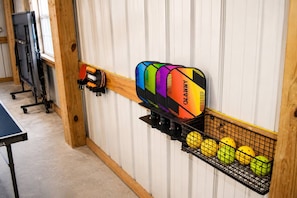 A bowling alley with a pinsetter and a rack of bowling balls. - Prather Ridge Estate | 3BR | Bourbon + Pickleball + Sauna (Chaplin)