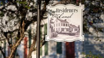 A sign with the text 'Residences on Canal' and an illustration of a house.