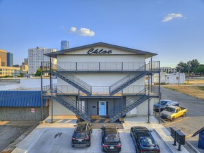 A building with a sign reading 'Chloe' and a parking lot with several cars. - Remodeled 1Bed Apartment #10 (Oklahoma City)