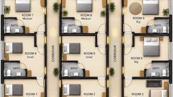 A floor plan of a hotel with three kitchens, multiple bathrooms, and rooms of varying sizes.