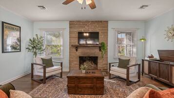 Mid-century living room with brick fireplace