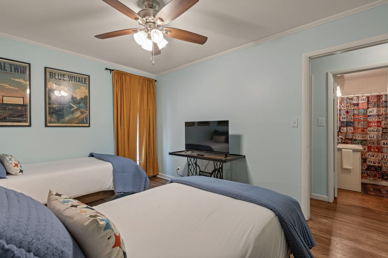 Bedroom 2: TV, steps from the bathroom