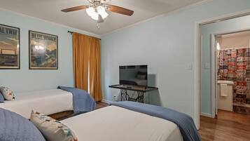 Bedroom 2: TV, steps from the bathroom