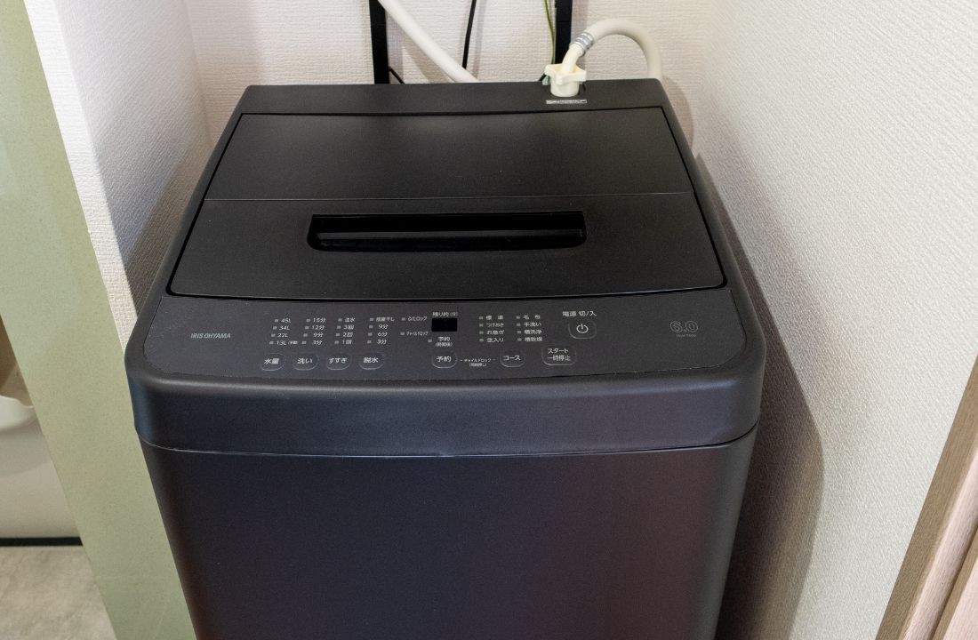 A black printer with a control panel and a paper output slot.