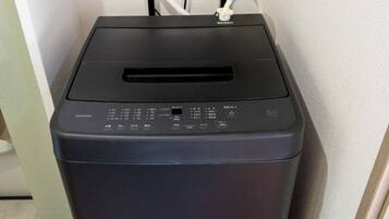 A black printer with a control panel and a paper output slot.