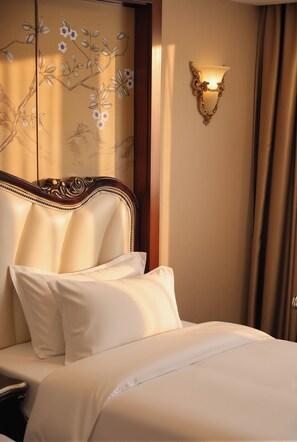 A hotel room with a large bed, a wall-mounted light fixture, and a decorative panel with floral designs.