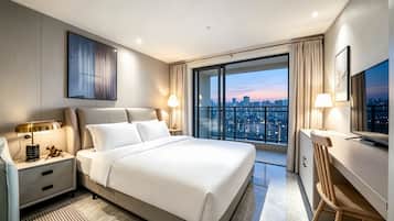 A modern hotel room with a large bed, a desk, a television, and a city view.
