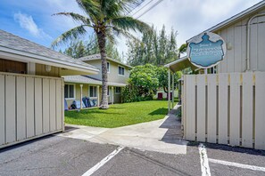 A gated entrance to a residential area with a sign welcoming to Waimanalo Beach Cottages. - Steps to Beach! Waimanalo Beach Cottages, Unit 10 (Waimanalo)
