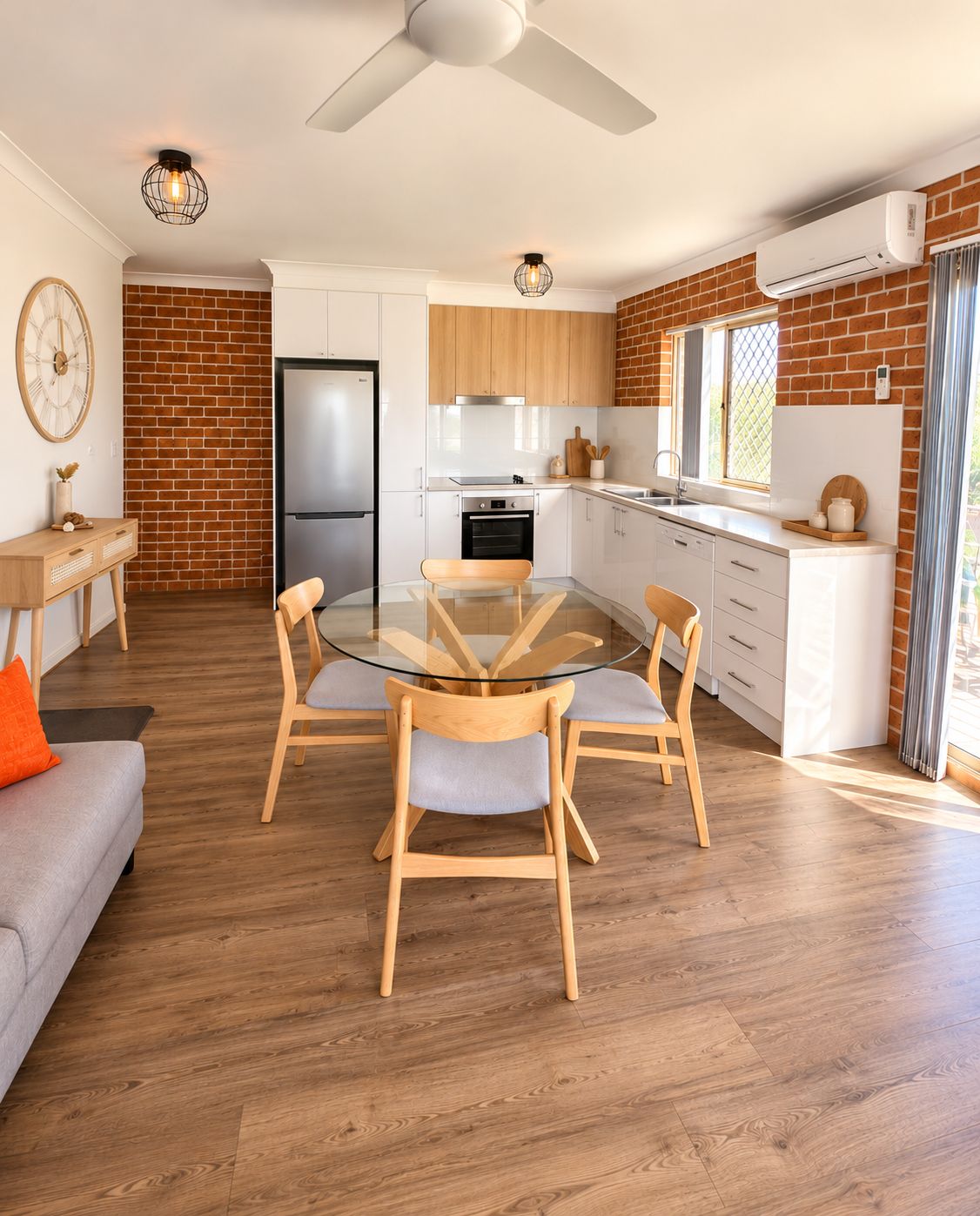 Light-filled dining area overlooking the open-plan kitchen and living space.