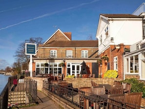 A riverside building with a sign for 'Mercure Thames Lodge.' - London Thames View Vintage by Palette Resorts (Staines)