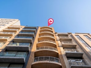 A multi-story building with a prominent red location marker on the top. - Amielie with lateral seaview by Interhome (Blankenberge)